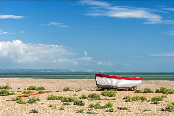 A fishing boat on Dungeness shingle beach, Kent, England