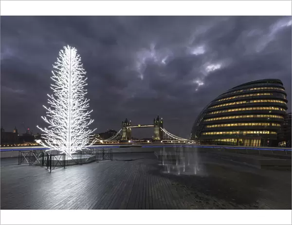 Tower Bridge and City Halll at night with a Christmas tree in the foreground, London