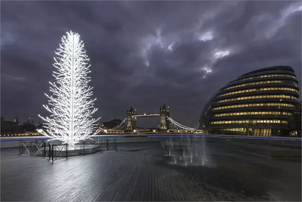 Tower Bridge and City Halll at night with a Christmas tree in the foreground, London