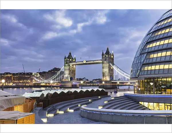 Tower Bridge and City Hall, right, designed by Norman Foster illuminated at Christmas