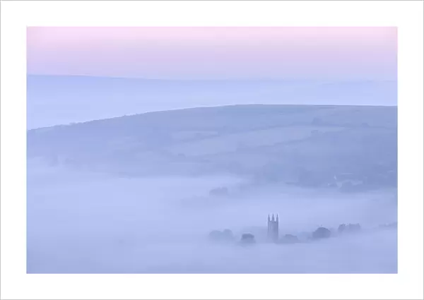 Widecombe in the Moor shrouded in morning mist, Dartmoor, Devon, England