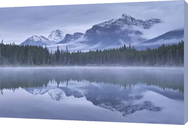 Dramatic Canadian Rockies mountain vista reflected in Herbert Lake, Banff National Park