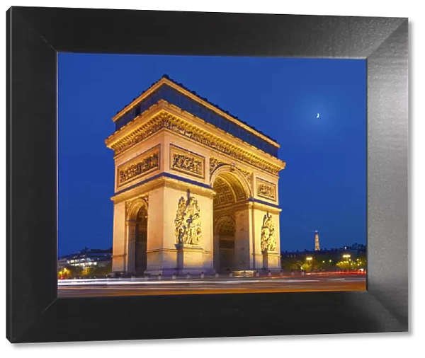 France, Paris, Arc de Triomphe and Eiffel Tower illuminated at night