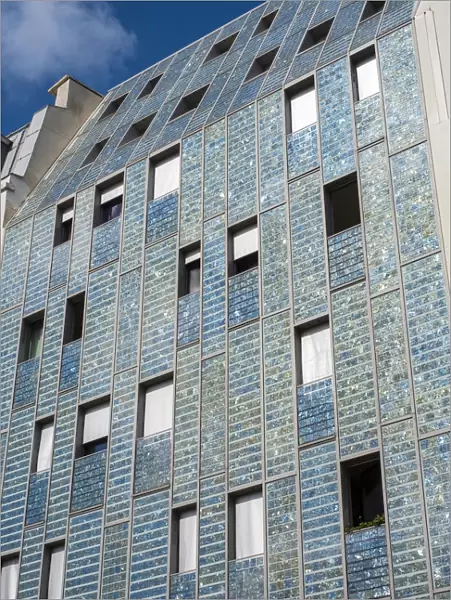 Facade of building covered in Photovoltaic (PV) solar panels for sustainable power