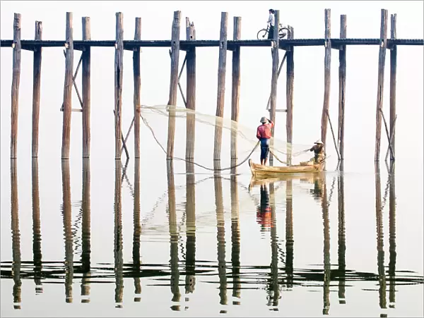 Fishermen next to the U Bein Bridge, a 1