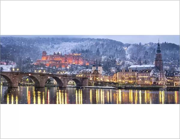 Heidelberg castle in winter with the Old Bridge and Church of the Holy Spirit along