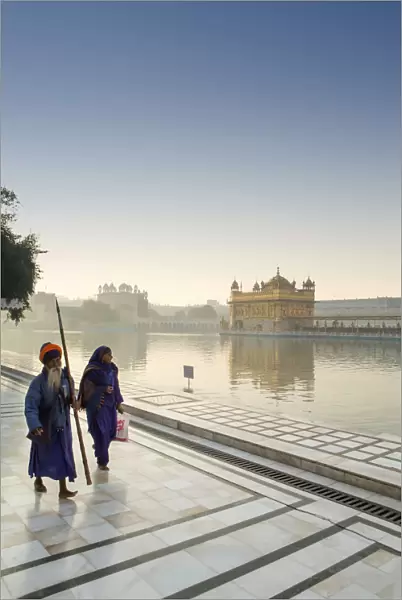 India, Punjab, Amritsar, sikh pilgrims, one carrying a barcha spear at the Golden