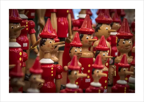 Europe, Italy, Veneto. Pinocchio toys at a market in Verona
