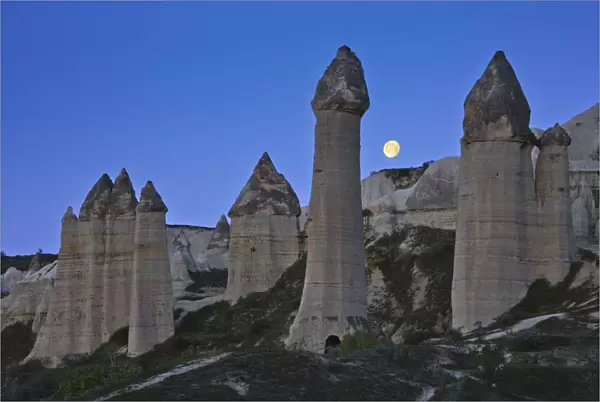 Moon over Fairy Chimneys in Honey Valley, near Goreme, Cappadocia, Turkey