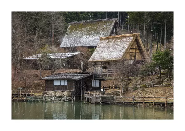 Old farmhouses under a snowfall at Hida Minzoku Mura Folk Village, Takayama, Gifu