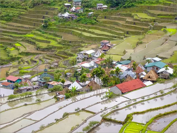 Batad village and flooded rice fields during early spring rice planting season, Banaue
