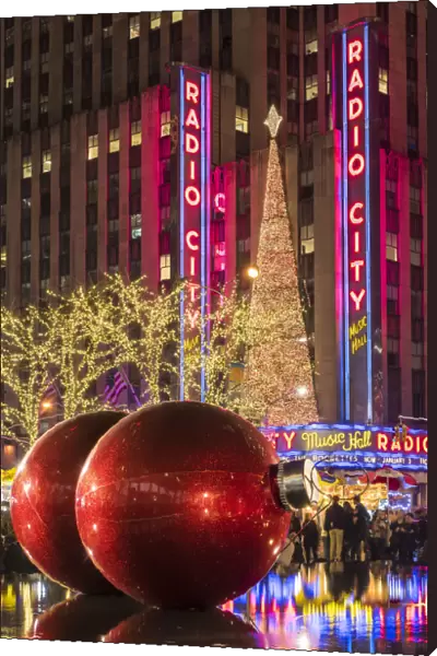 Giant red Christmas ornaments on display on Avenue of Americas (6th Avenue) during