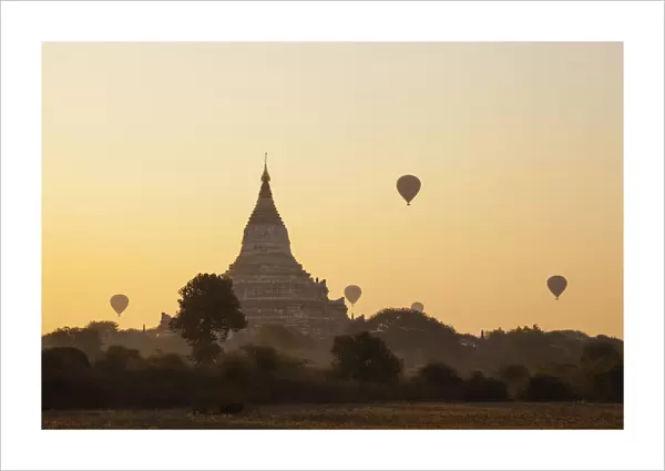 Myanmar (Burma), Bagan, Shwesandaw Pagoda and Hot Air Balloons at Sunrise