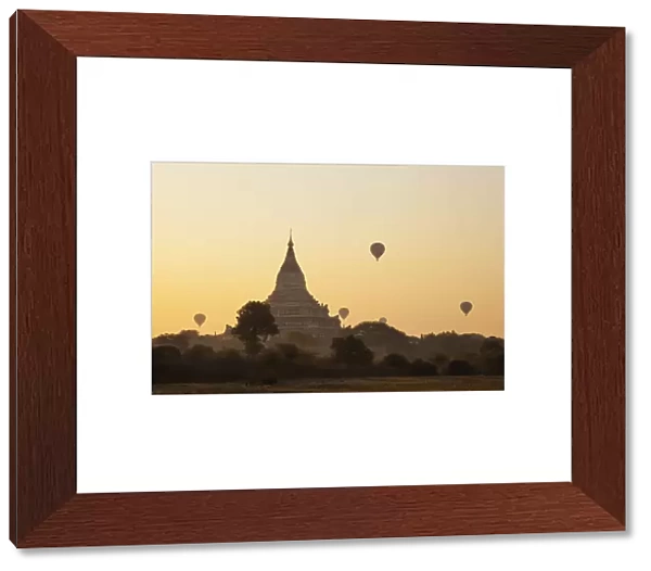 Myanmar (Burma), Bagan, Shwesandaw Pagoda and Hot Air Balloons at Sunrise