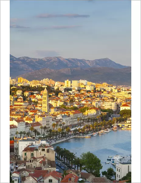 Elevevated view over the picturesque harbour city of Split illuminated at sunset, Split