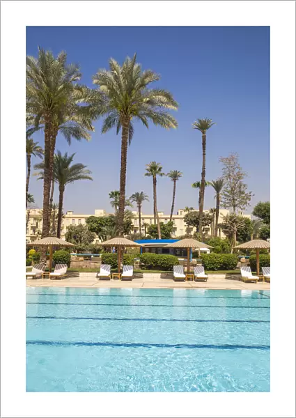 Egypt, Luxor, Swimming pool in the Garden at the The Winter Palace Hotel
