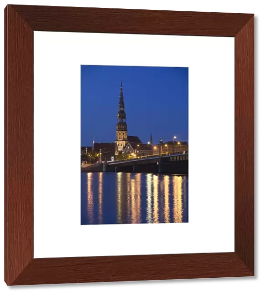 Latvia, Riga, Old Riga, St. Peters Lutheran Church and Akmens Bridge, evening