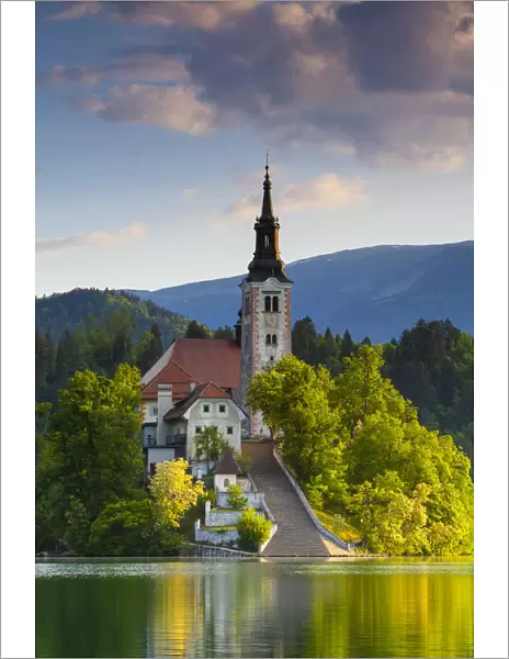 Bled Island with the Church of the Assumption illuminated at sunrise, Lake Bled, Bled