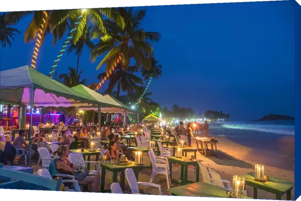 Restaurants on beach at dusk, Mirrisa, South Coast, Sri Lanka