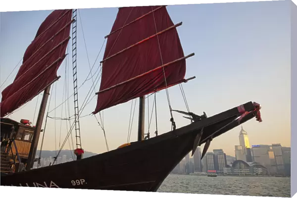 China, Hong Kong, Kowloon, Victoria Harbour, Junk Boat Sail and City Skyline in Background