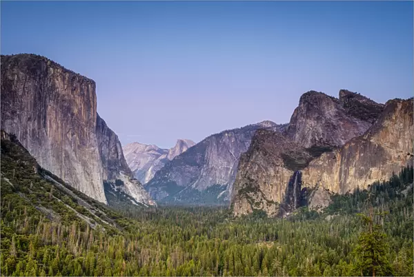 Idyllic shot of alpine forest amidst rocky mountains at Tunnel View