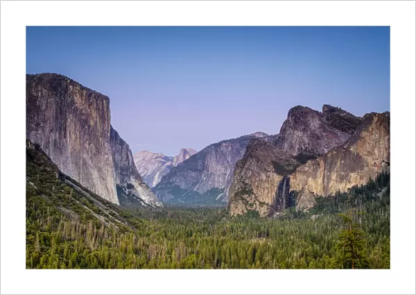 Idyllic shot of alpine forest amidst rocky mountains at Tunnel View