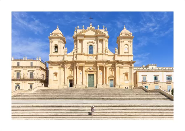 Tourist climbing the stairs of St nicholas church cathedral of Noto, Siracusa province