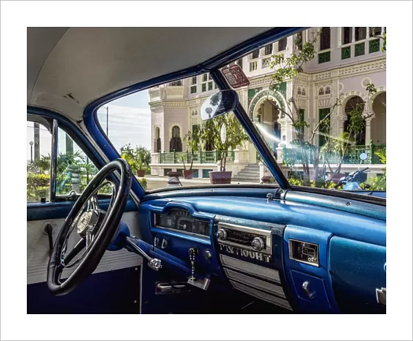 Vintage car in front of Palacio de Valle, Cienfuegos, Cienfuegos Province, Cuba
