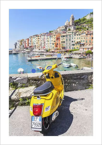 Yellow Vespa scooter parked near harbour, Portovenere, La Spezia district, Liguria, Italy
