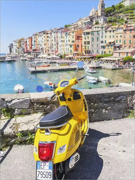 Yellow Vespa scooter parked near harbour, Portovenere, La Spezia district, Liguria, Italy