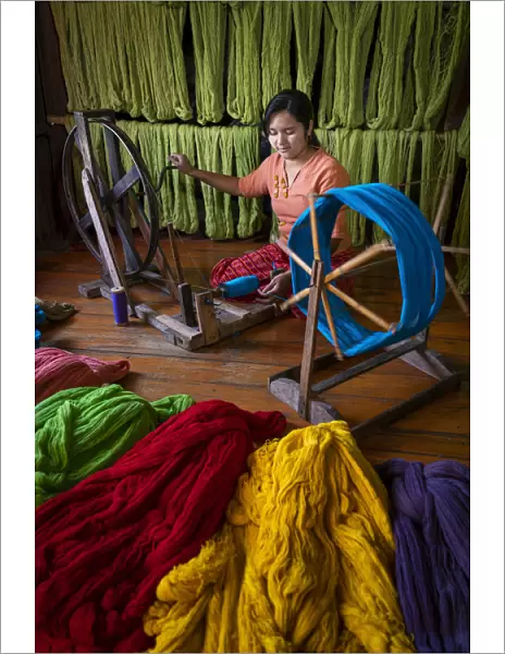 Woman winding up thread at weaving workshop on Lake Inle, Nyaungshwe Township