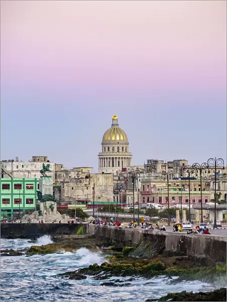 View over El Malecon and Centro Habana towards El Capitolio at dusk, Havana