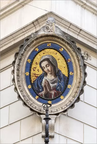 Traditional Madonnella or Madonna mosaic placed in a buildings corner, Rome, Lazio