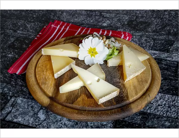 Selection of typical italian cheese in wood chopping board