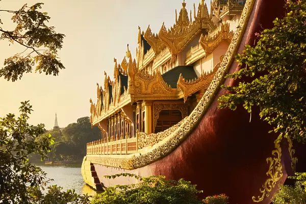 The 'Karaweik'barge with the stupa of the 'Shwedagon Pagoda'