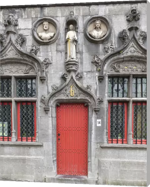 Red Door of the Basilica of the Holy Blood in Burg Square, Bruges, Belgium