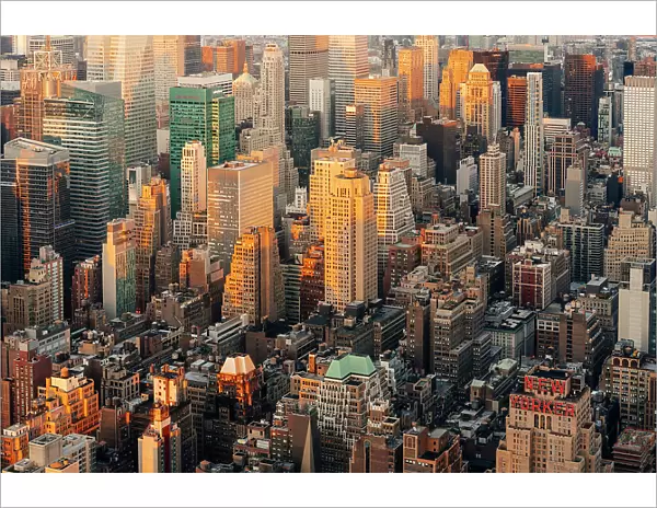 New York City buildings at sunset. New Yorker sign. Manhattan, USA