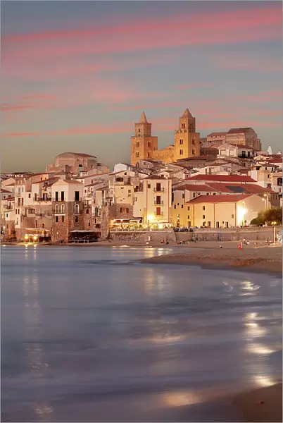 Italy, Sicily, Cefalu, the old town illuminated at sunset