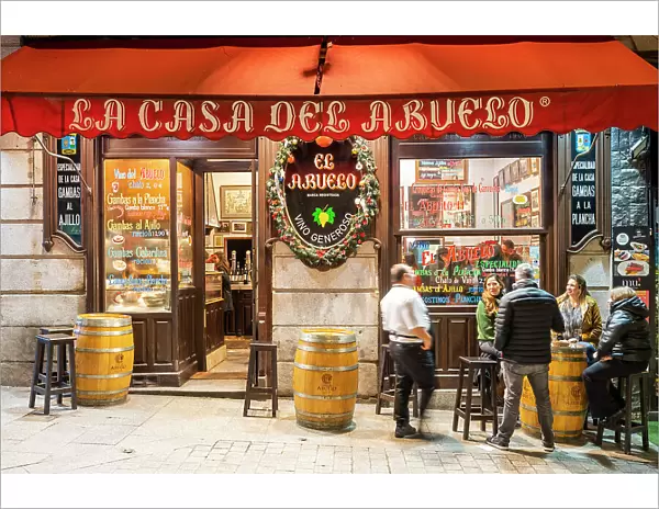 Scenic night view of a bar restaurant in the Barrio de Las Letras or Literary Quarter, Madrid, Spain