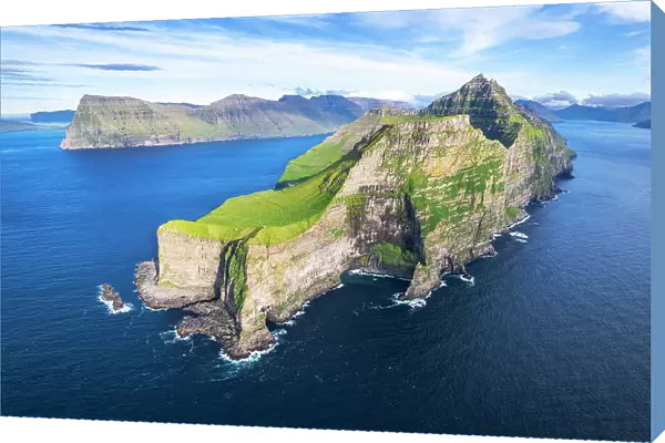 Panoramic aerial view of the island of Kalsoy with the Kallur lighthouse cliff in the foreground, Kalsoy island, Faroe islands, Denmark