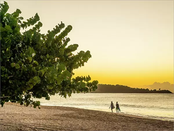 Two people walking at sunset, Grand Anse Beach, Grenada, Caribbean