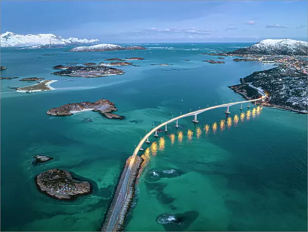 Aerial view of Sommaroy island and majestic bridge along a fjord in winter, Troms county, Norway