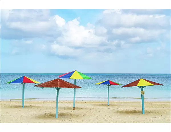 Multicolored beach umbrellas on a tropical shore, Antigua, Antigua & Barbuda, Caribbean, West Indies