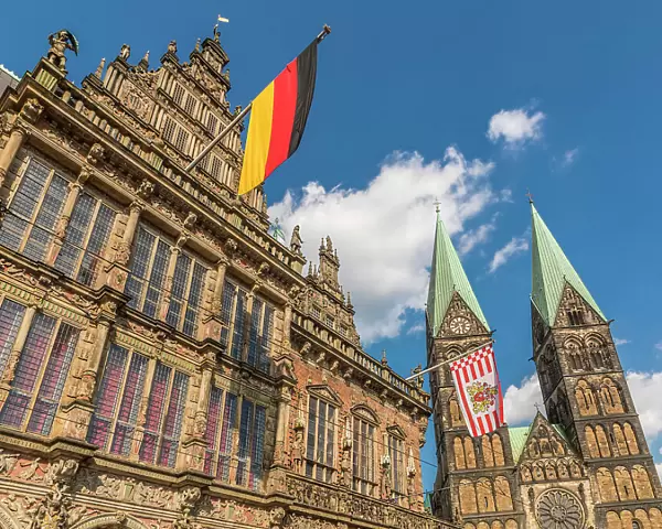 Town hall with Germany and Bremen flag in front of St. Petri Cathedral on the market square, Bremen, Germany