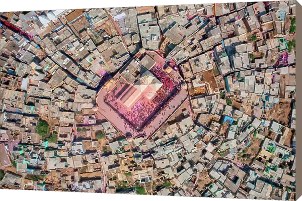 Aerial view of people celebrating the holy colour festival near the Shri And Baba Temple, Uttar Pradesh, India