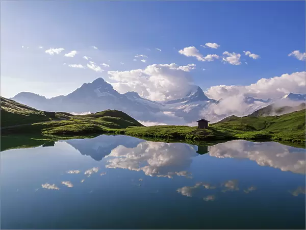 Alpine peaks reflecting in the water of the lake of Bachalpsee, Grindelwald, Bernese Oberland, Switzerland