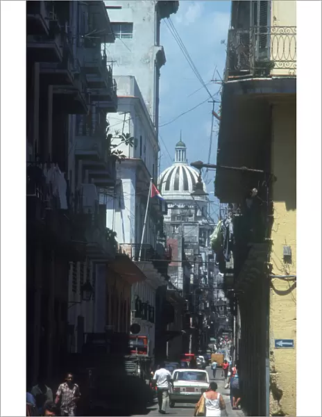 10093392. CUBA Havana Old Havana Street leading to Capitol Science Academy