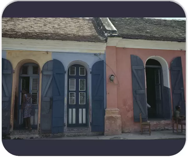 20076520. HAITI Cap Haitien Street scene with typical colonial style architecture