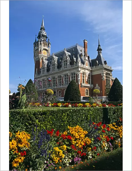 20085863. FRANCE Nord Picardy Pas-de-Calais Calais colourful flowers and Town Hall