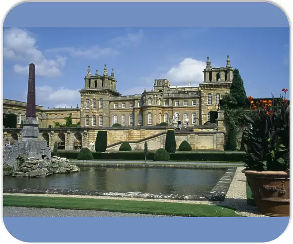 ENGLAND, Oxfordshire, Woodstock Blenheim Palace. View across formal gardens towards